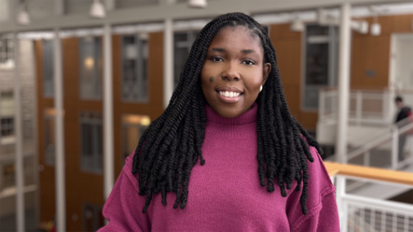 Headshot of a student in a purple sweater 